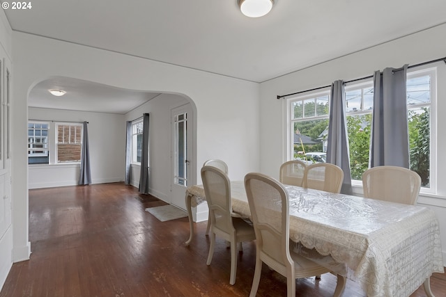 dining area featuring dark hardwood / wood-style floors