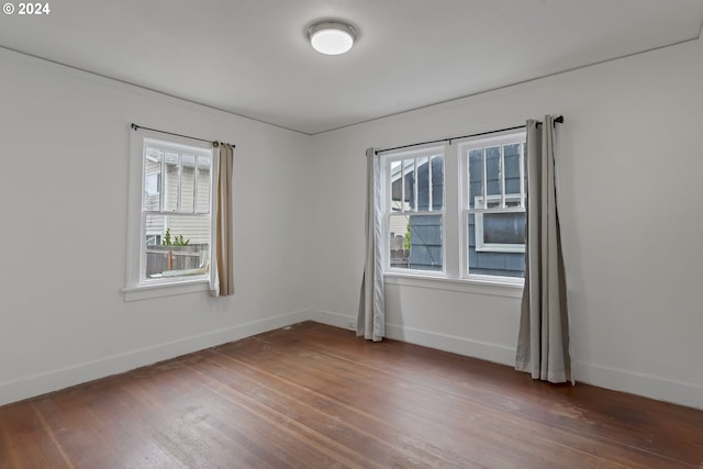 unfurnished room featuring wood-type flooring