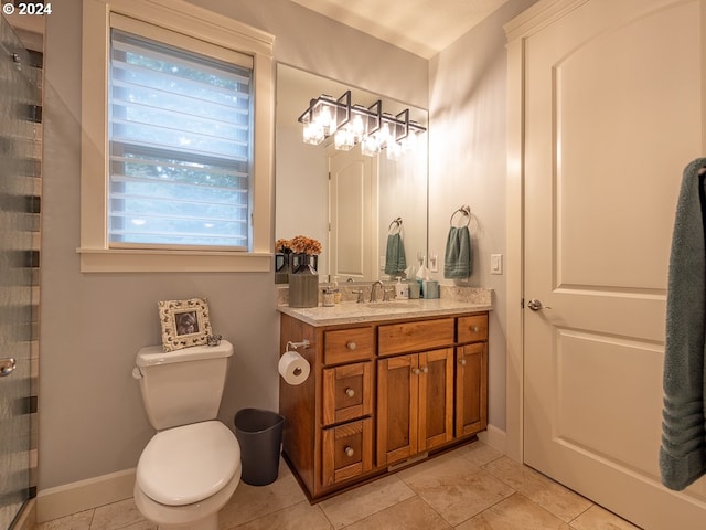 bathroom featuring tile patterned floors, vanity, and toilet