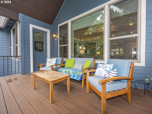 wooden terrace featuring an outdoor hangout area