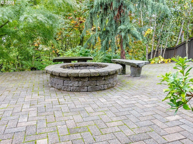 view of patio / terrace with an outdoor fire pit