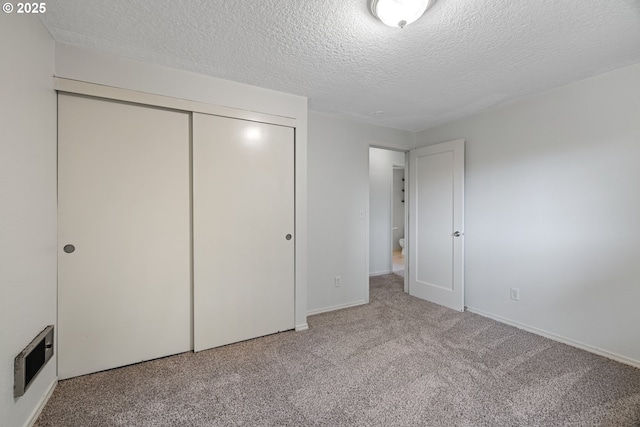 3314 SE 85th Ave, Portland, OR 97266 - unfurnished bedroom with a textured ceiling, carpet floors, a closet, and baseboards