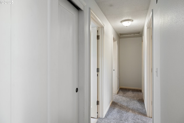3314 SE 85th Ave, Portland, OR 97266 - corridor with a textured ceiling, carpet, and baseboards