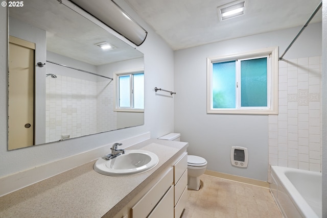 3314 SE 85th Ave, Portland, OR 97266 - bathroom with heating unit, vanity, toilet,  shower combination, and baseboards