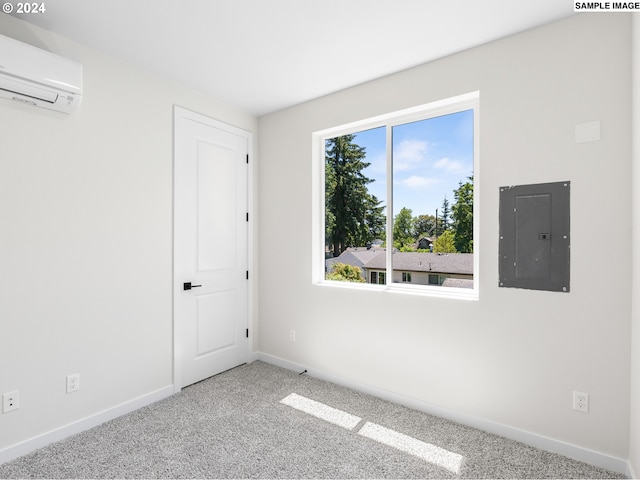 carpeted empty room with a wall mounted air conditioner and electric panel