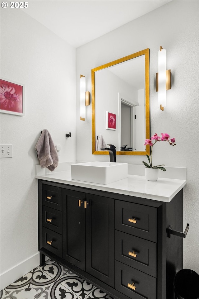 bathroom featuring vanity and baseboards