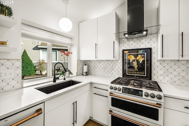 kitchen featuring white range with gas stovetop, white cabinets, dishwashing machine, wall chimney range hood, and a sink