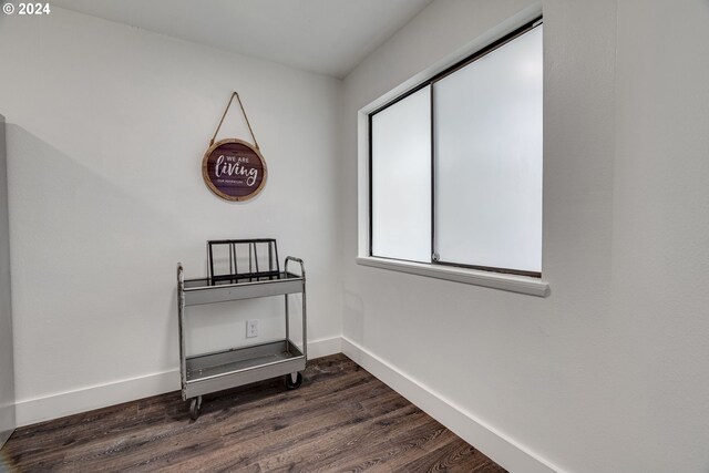 dining space featuring crown molding and dark hardwood / wood-style flooring