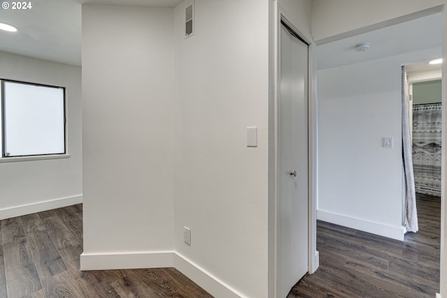 hall with dark wood-type flooring