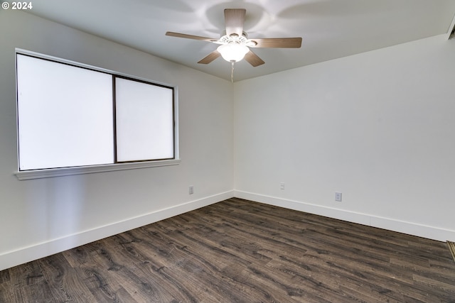 unfurnished room with ceiling fan and dark hardwood / wood-style flooring