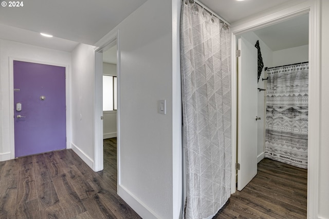 hall featuring dark wood-type flooring