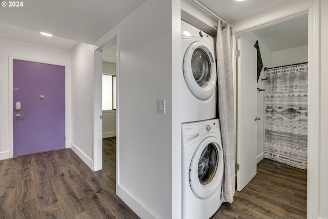 washroom with stacked washer and clothes dryer and dark hardwood / wood-style flooring