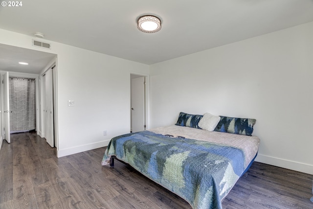 bedroom featuring dark hardwood / wood-style flooring