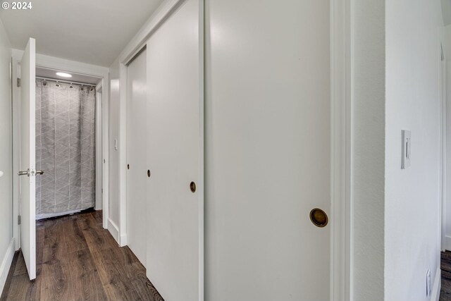 bedroom with dark wood-type flooring