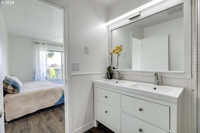 bathroom featuring vanity and hardwood / wood-style floors