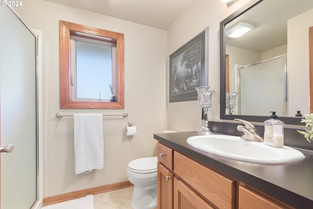 bathroom featuring vanity, toilet, tile patterned floors, and walk in shower