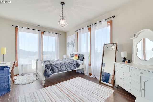 bedroom featuring dark hardwood / wood-style flooring