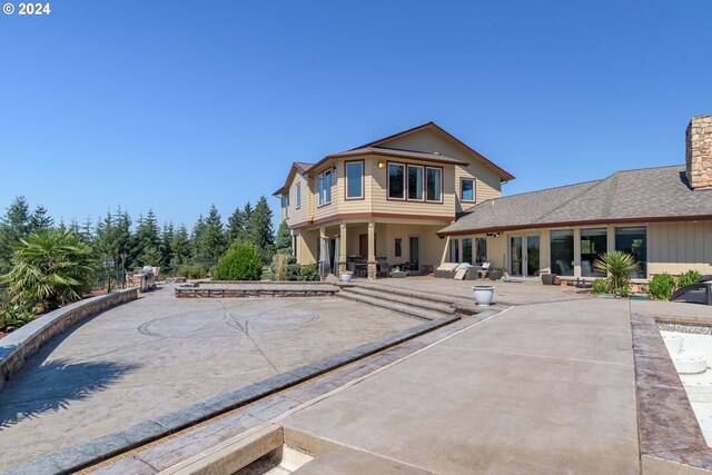 back of property with a patio area