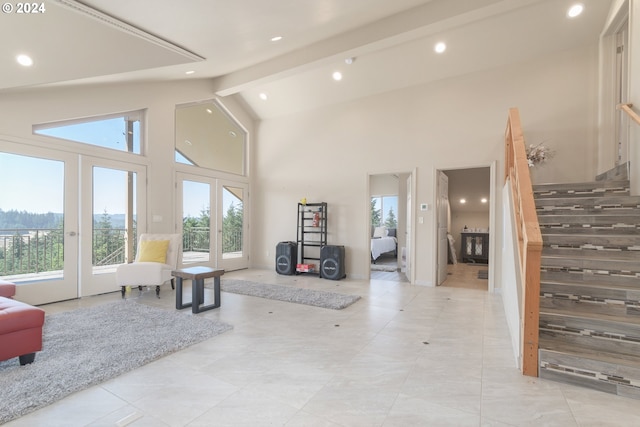 tiled living room with high vaulted ceiling and beam ceiling