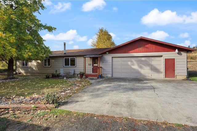 ranch-style home with a garage and a front yard