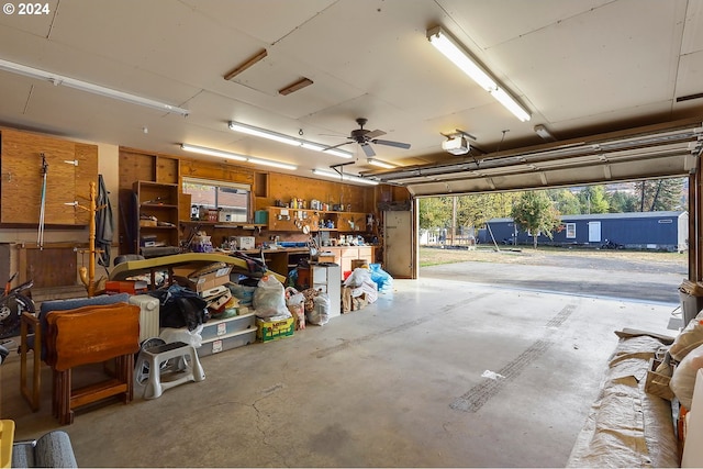 garage with a garage door opener and a workshop area