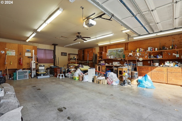 garage featuring a garage door opener and a workshop area