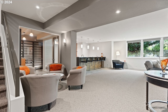 carpeted living area featuring stairs, baseboards, and recessed lighting