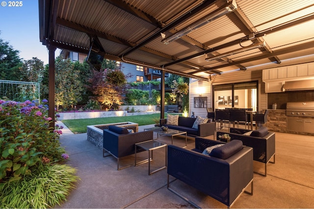 view of patio featuring an outdoor hangout area, exterior kitchen, and a grill