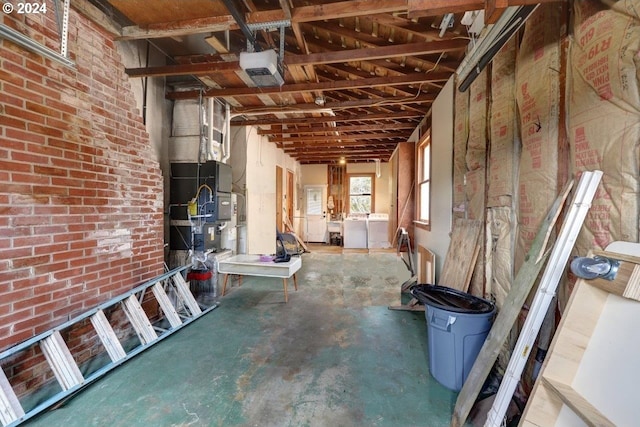 miscellaneous room with separate washer and dryer and concrete floors