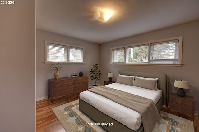 bedroom with light hardwood / wood-style flooring