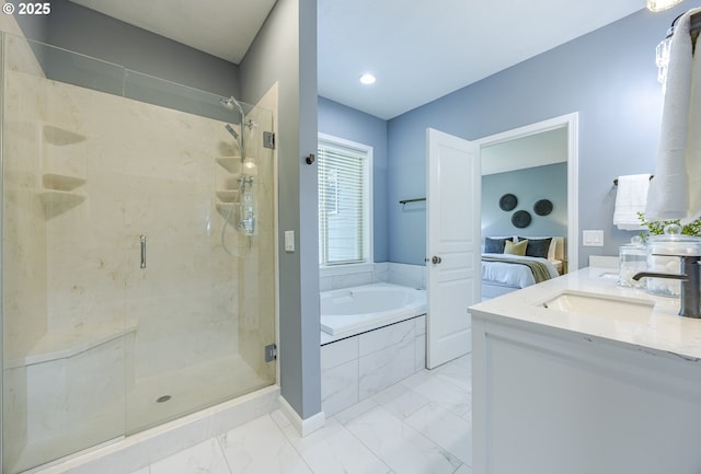 ensuite bathroom with vanity, marble finish floor, a bath, and a stall shower
