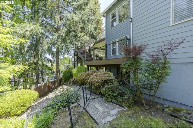 view of side of home with fence