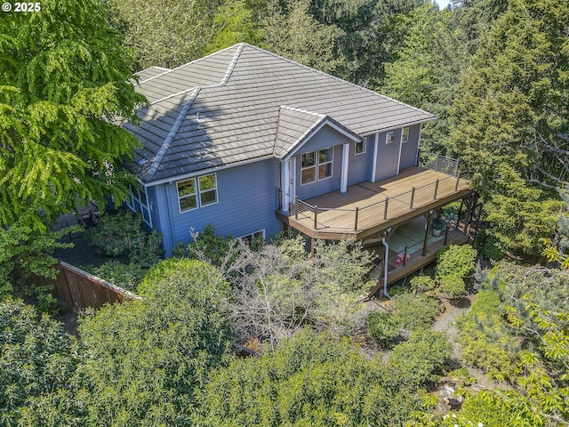 drone / aerial view with a wooded view