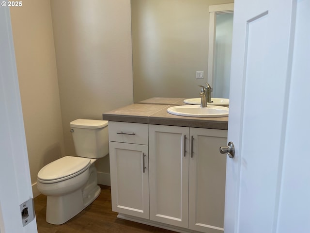 17344 SW Wapato Island Dr Unit 27, Sherwood, OR 97140 - bathroom with vanity, toilet, and wood finished floors