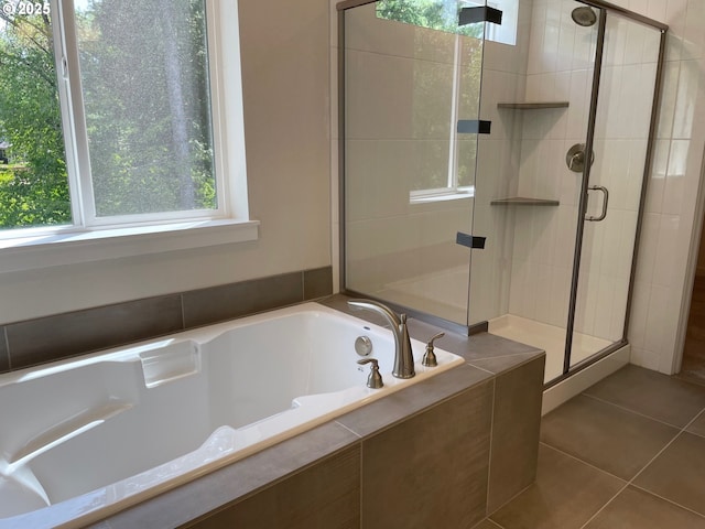 17344 SW Wapato Island Dr Unit 27, Sherwood, OR 97140 - bathroom featuring healthy amount of natural light, a shower stall, a bath, and tile patterned flooring