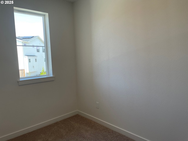 17344 SW Wapato Island Dr Unit 27, Sherwood, OR 97140 - unfurnished room with baseboards and dark colored carpet