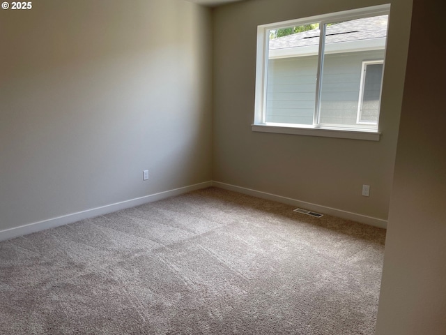 17344 SW Wapato Island Dr Unit 27, Sherwood, OR 97140 - spare room featuring carpet floors and baseboards