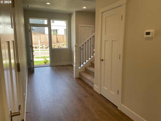 17344 SW Wapato Island Dr Unit 27, Sherwood, OR 97140 - foyer with healthy amount of natural light, baseboards, dark wood-style flooring, and recessed lighting