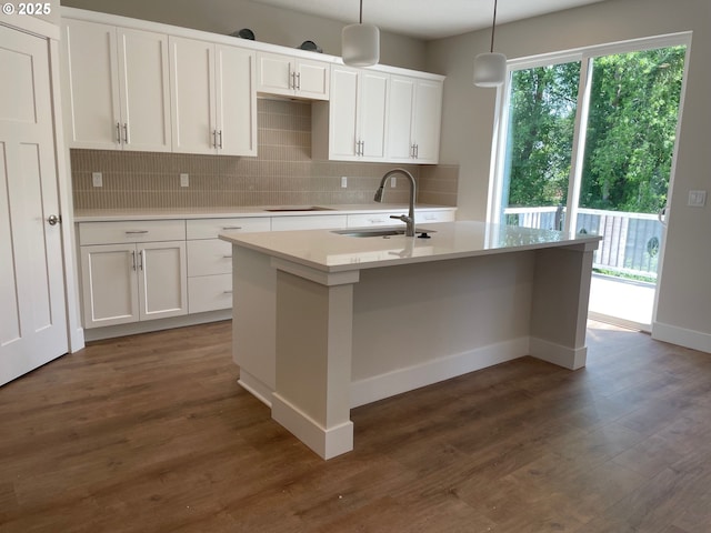 17344 SW Wapato Island Dr Unit 27, Sherwood, OR 97140 - kitchen with a sink, tasteful backsplash, white cabinets, a kitchen island with sink, and dark wood-style flooring