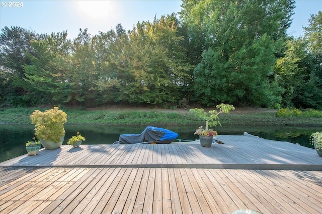 wooden terrace with a water view