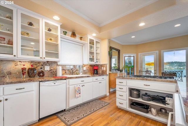 kitchen with dishwasher, stainless steel gas stovetop, crown molding, light wood-type flooring, and white cabinets