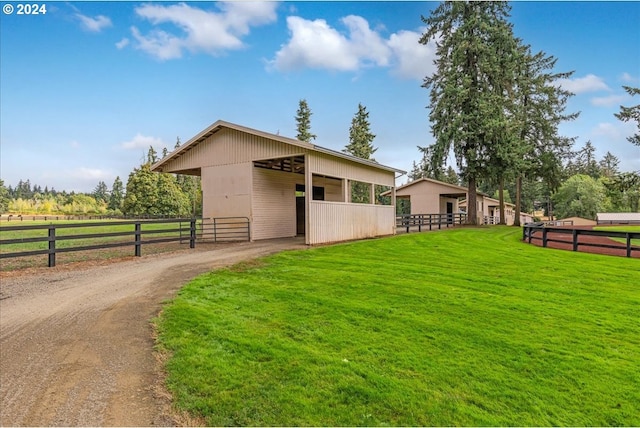 view of side of home featuring an outbuilding