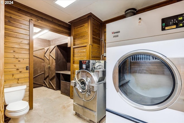 washroom featuring wooden walls