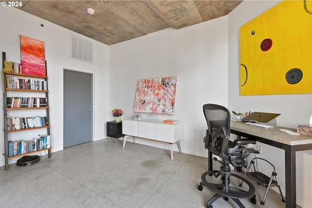 office space featuring visible vents and concrete flooring