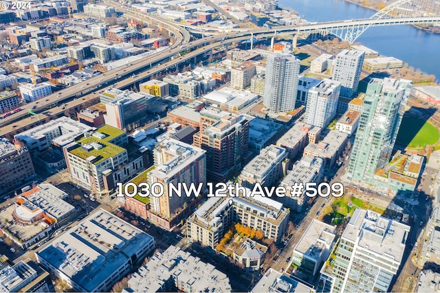 aerial view with a view of city and a water view