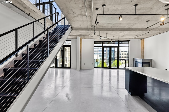 interior space with french doors and concrete floors