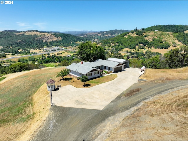 birds eye view of property with a mountain view