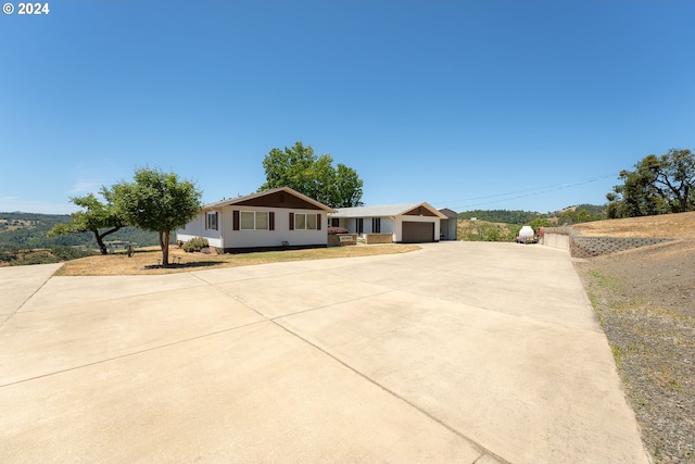 single story home with a garage