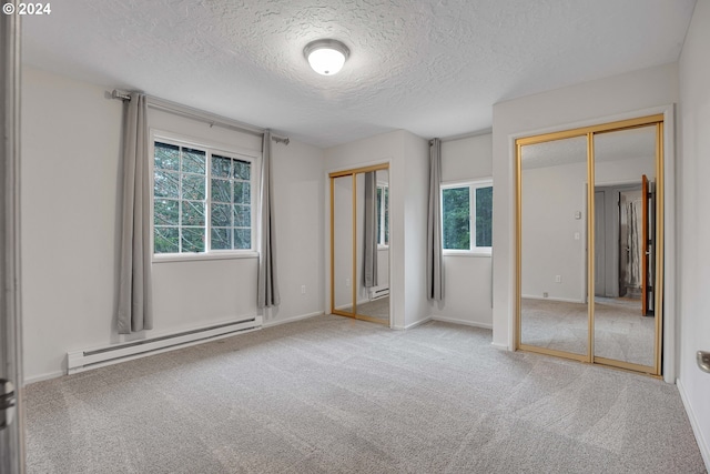 unfurnished bedroom with a closet, carpet floors, and a textured ceiling