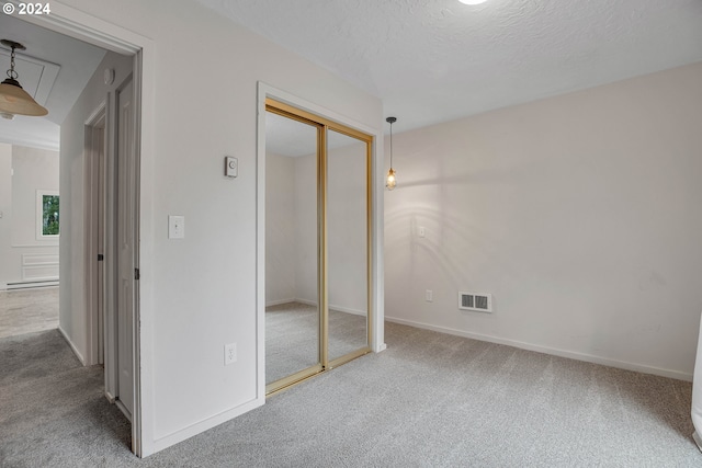 22715 SW Eagle Point Rd, Sheridan, OR 97378 - unfurnished bedroom featuring carpet floors, a textured ceiling, baseboards, and a closet